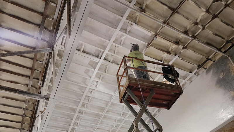 worker-spraying-foam-commerical-warehouse-cieling